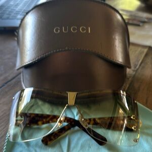 Gucci with gold frame and leopard sides